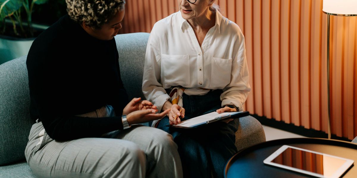 Career coach discussing resume strategy