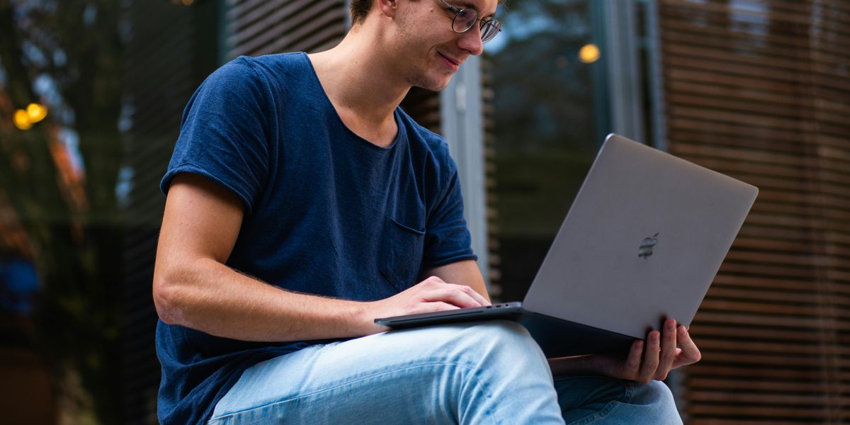 Engineering student typing a cover letter on laptop