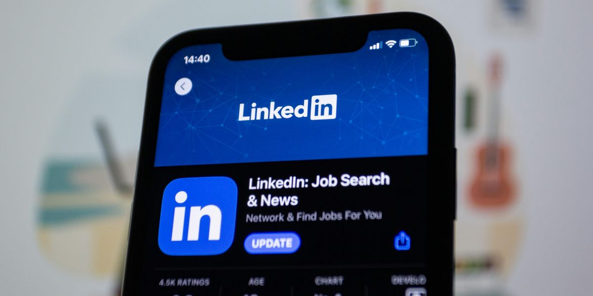 Person optimizing LinkedIn profile on smartphone