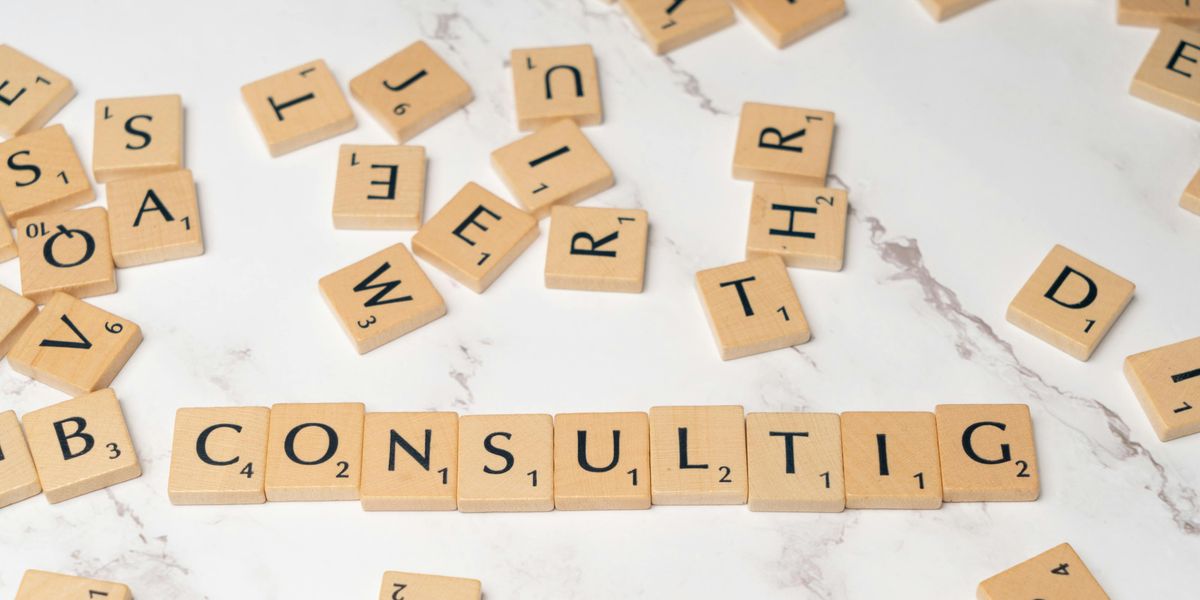 Professional woman editing cover letter for consulting applications